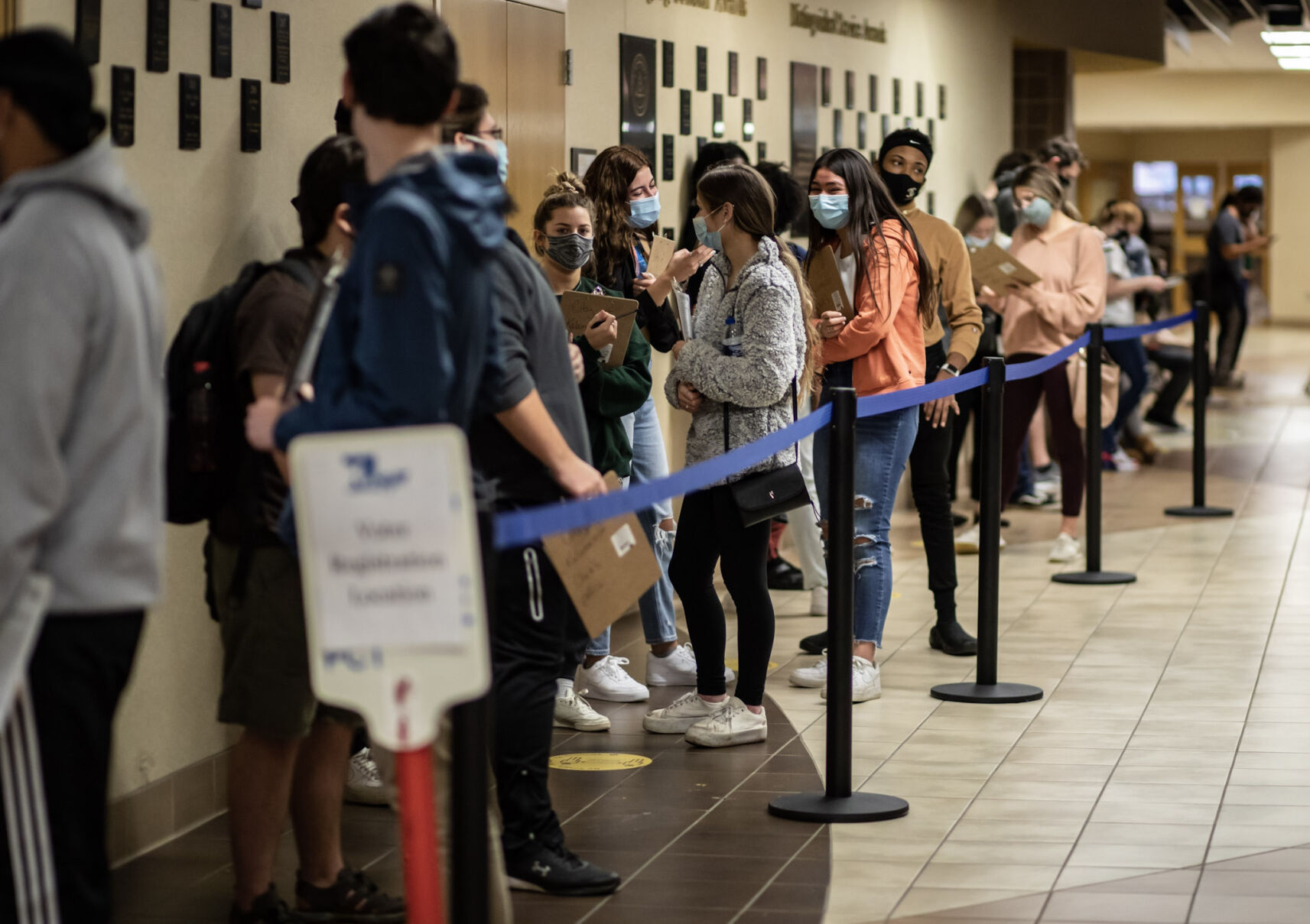 Students wait in line to vote at the Bernhard Center.